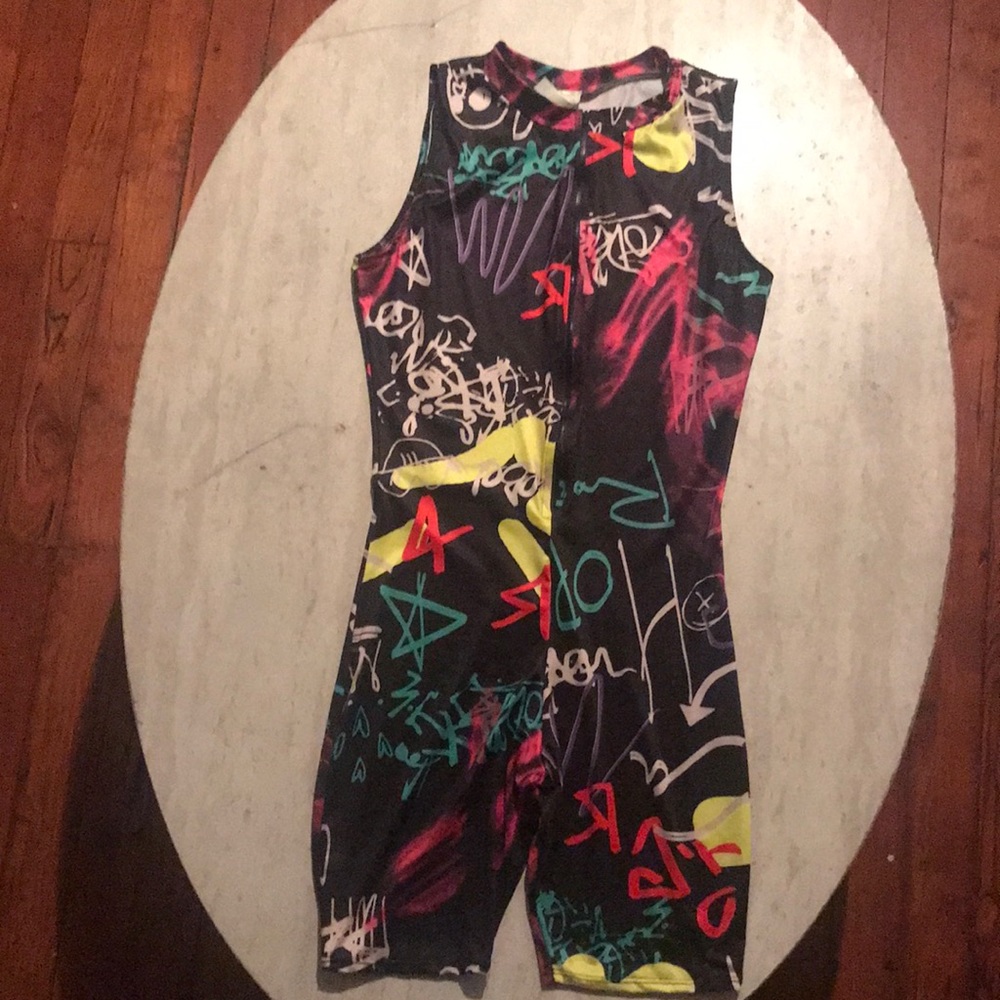 One piece zips in the front worn once. Super comfortable